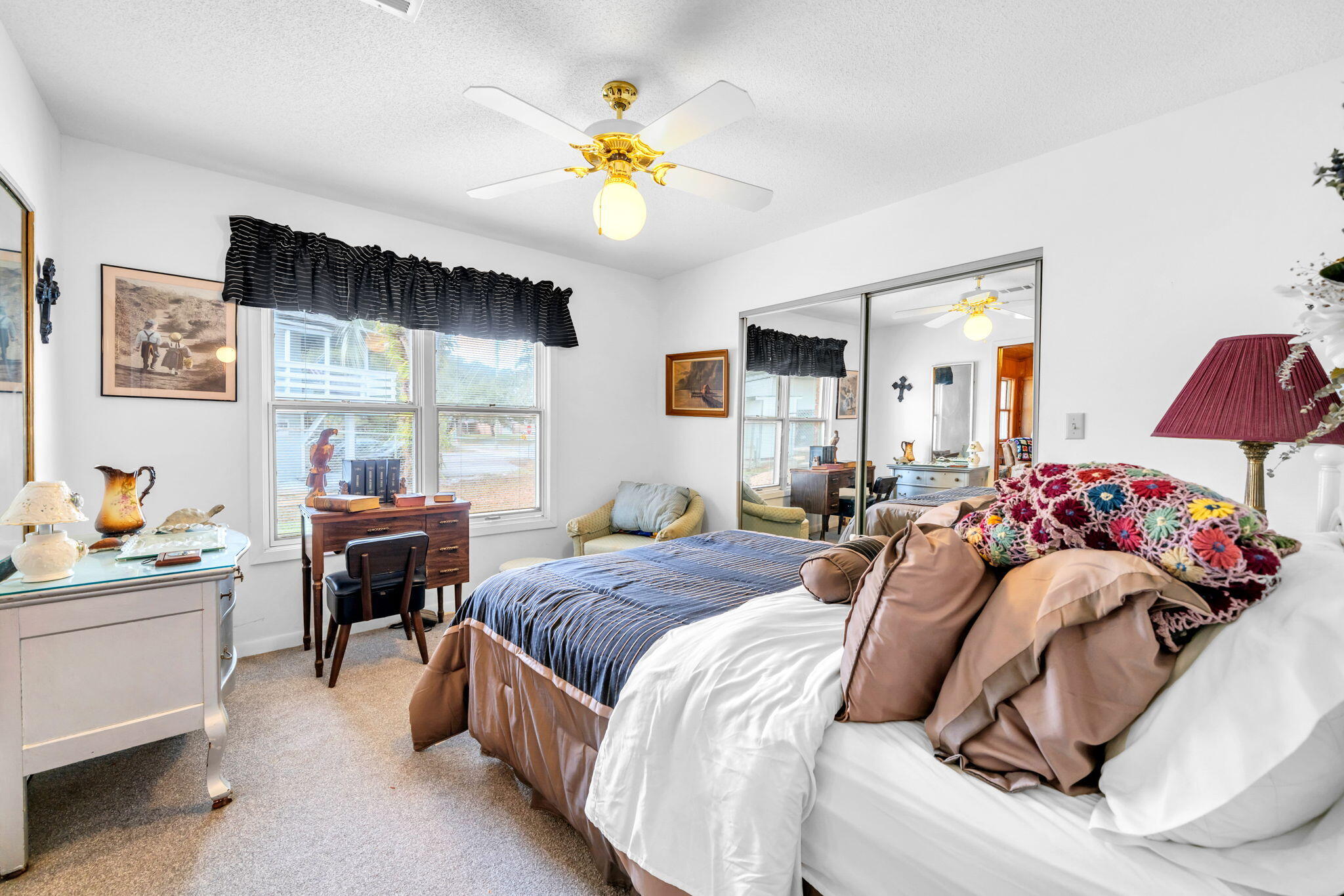 504 Kelly Street Destin, FL 32541 - Photo 46 of 92 a bedroom with a bed and a chandelier