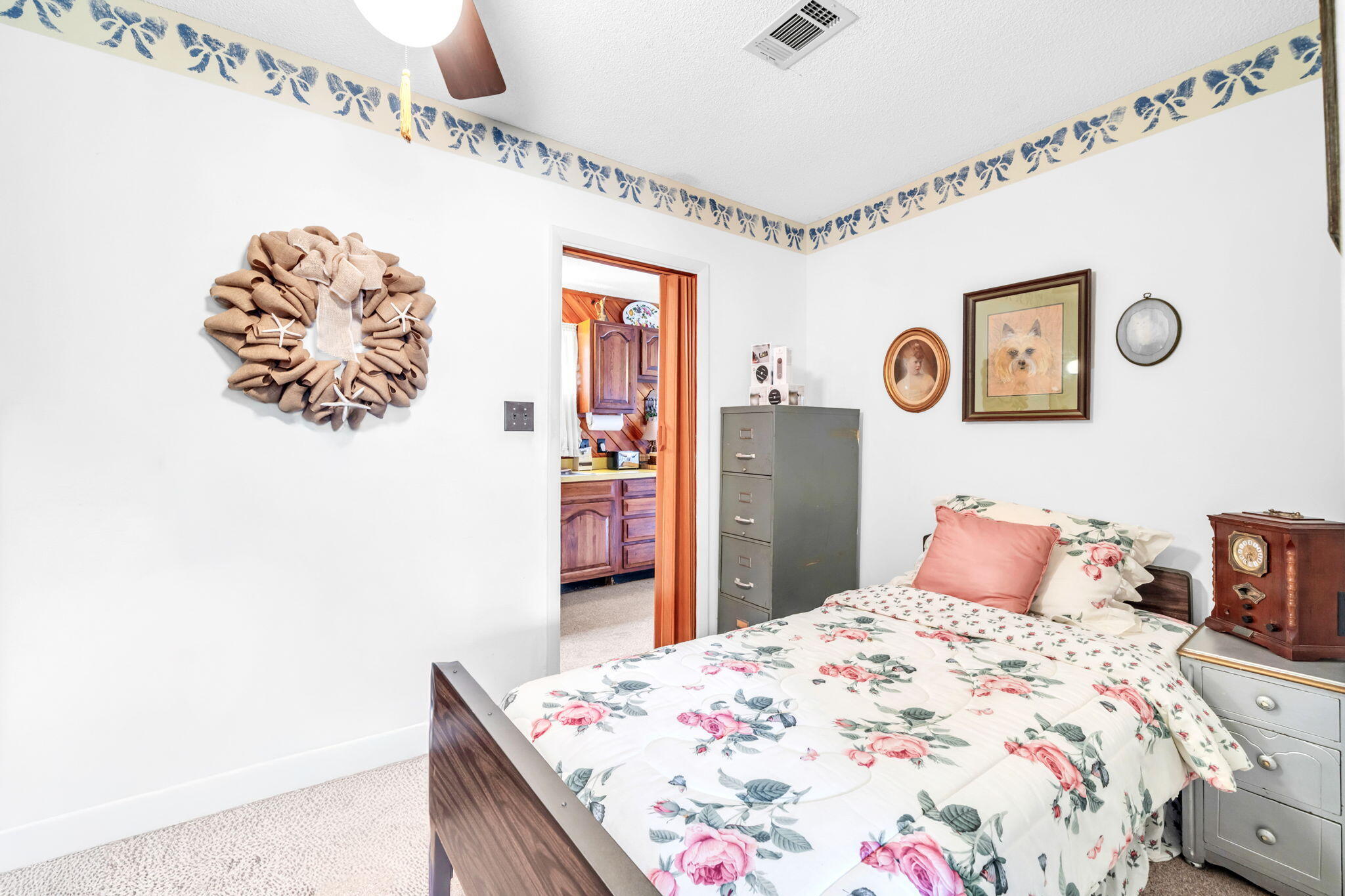 504 Kelly Street Destin, FL 32541 - Photo 48 of 92 a bedroom with a bed and a table in it