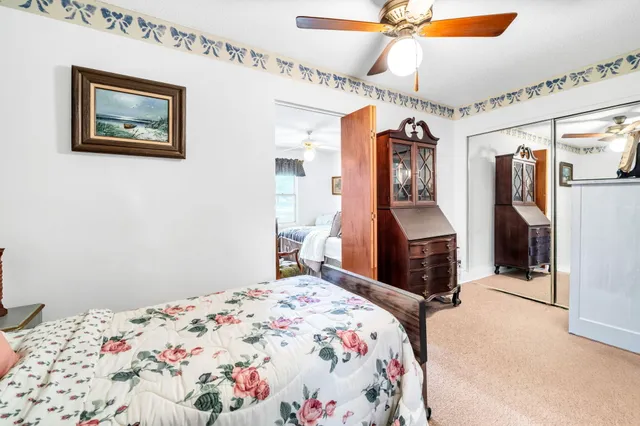 a view of a house with a backyard and a garage