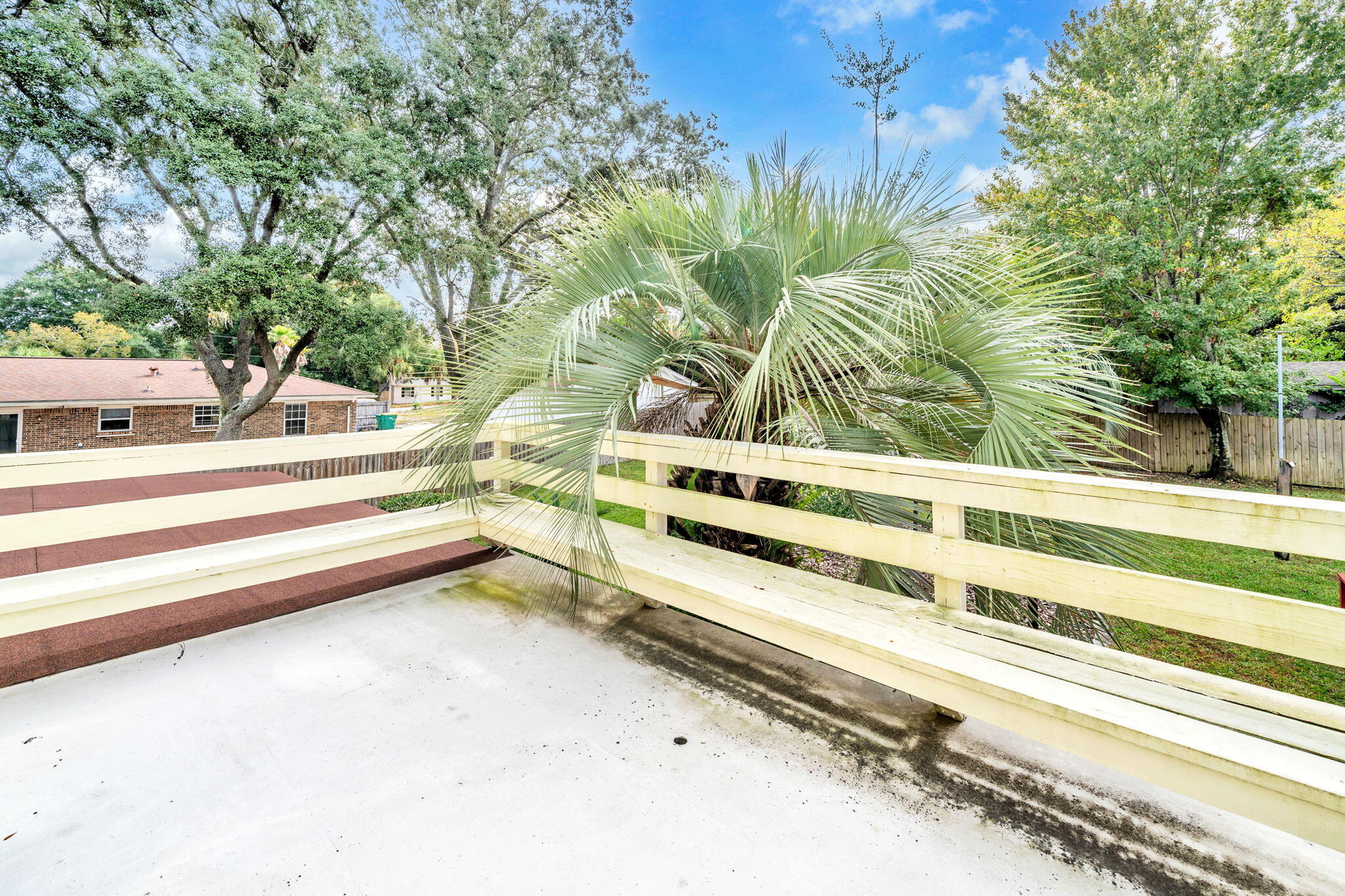 504 Kelly Street Destin, FL 32541 - Photo 51 of 92 a view of backyard with seating area and trees around