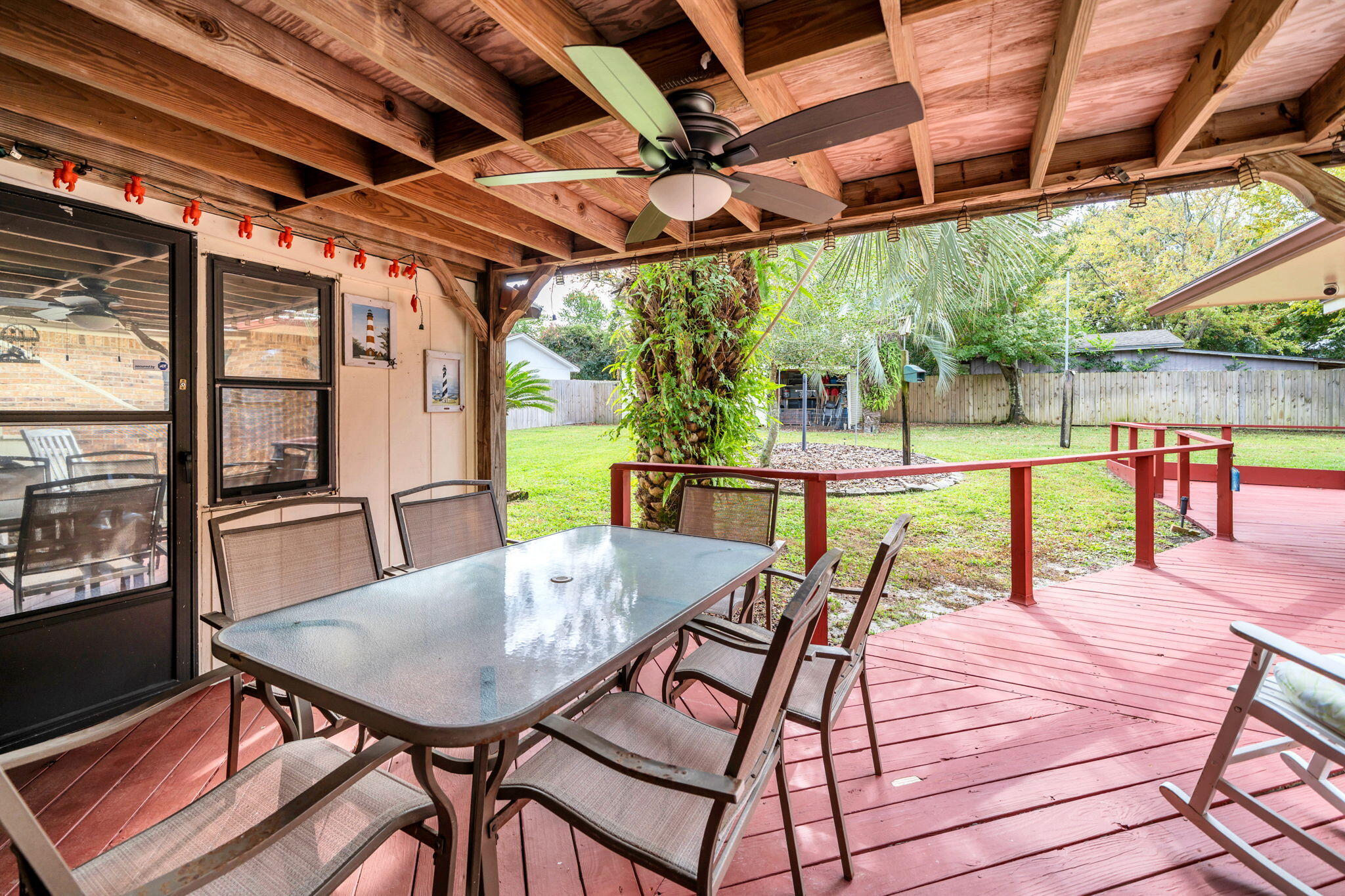 504 Kelly Street Destin, FL 32541 - Photo 53 of 92 a view of a patio with a table chairs and a patio