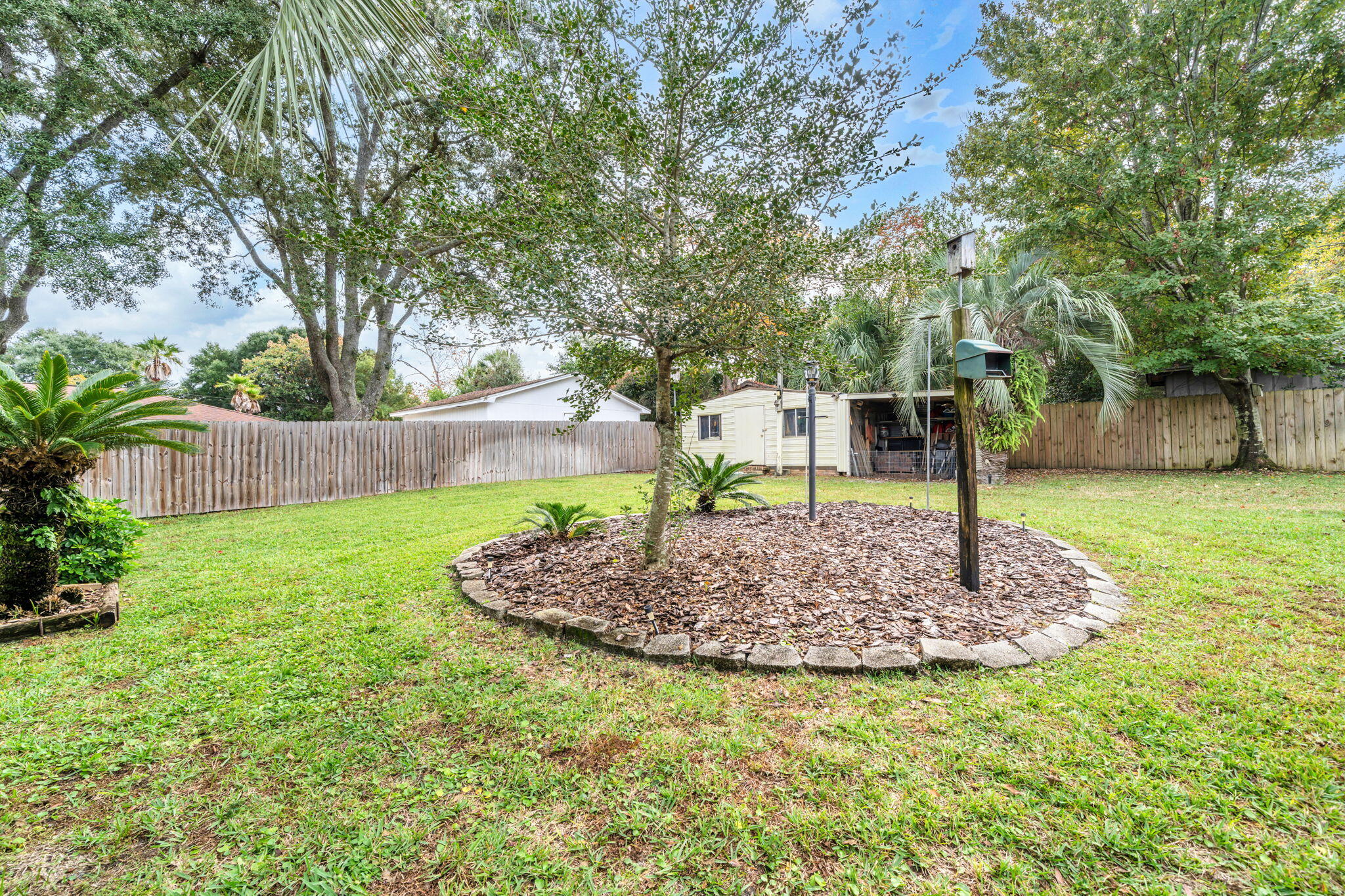 504 Kelly Street Destin, FL 32541 - Photo 56 of 92 a front view of a house with a yard