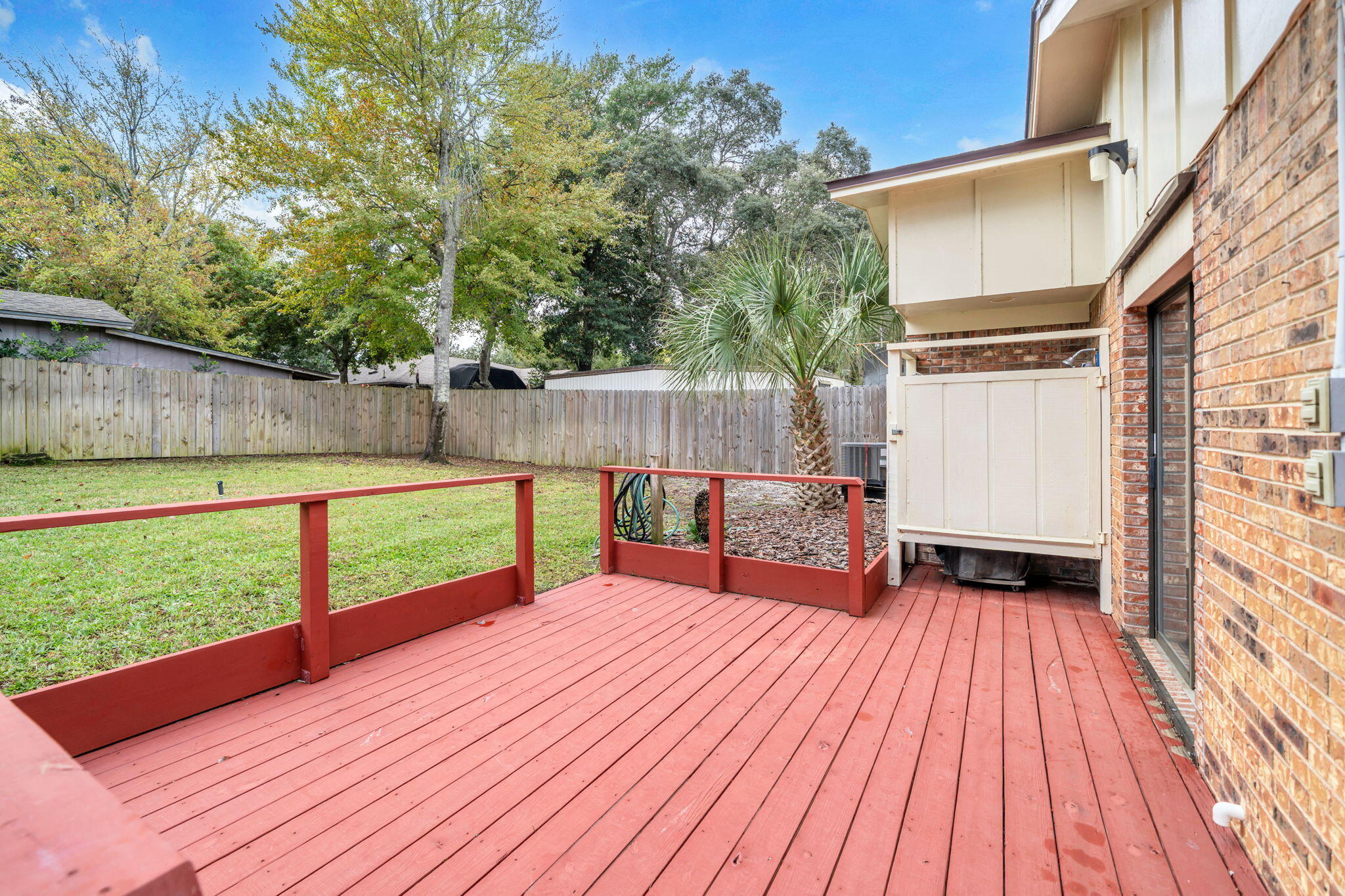 504 Kelly Street Destin, FL 32541 - Photo 57 of 92 a view of a backyard with wooden floor