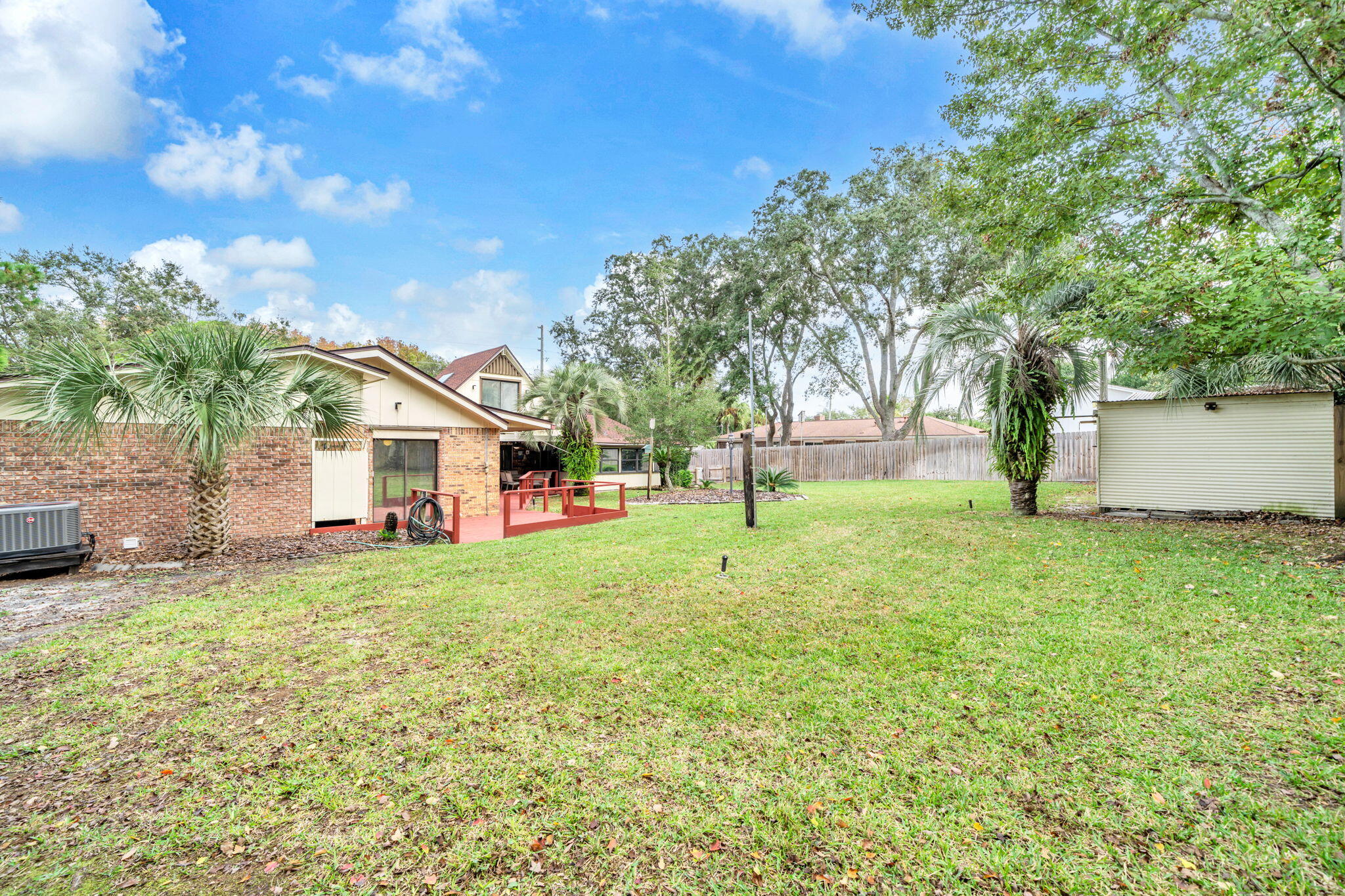 504 Kelly Street Destin, FL 32541 - Photo 59 of 92 a view of a house with a yard and tree s