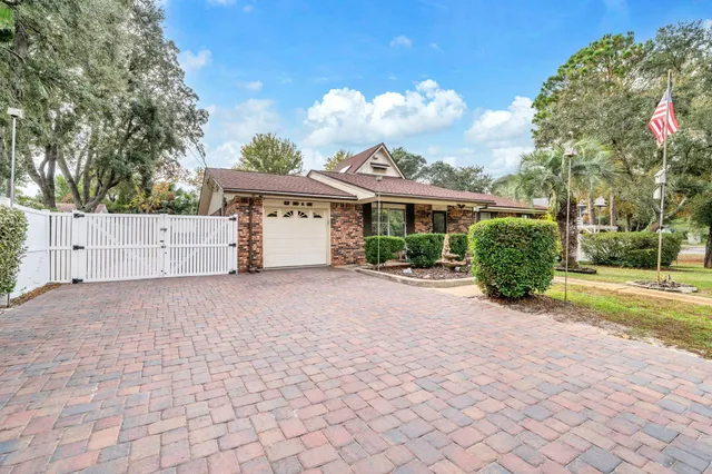 a living room with furniture a flat screen tv and a large window