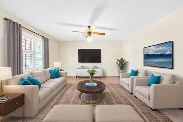 a kitchen with stainless steel appliances kitchen island granite countertop a sink cabinets and refrigerator