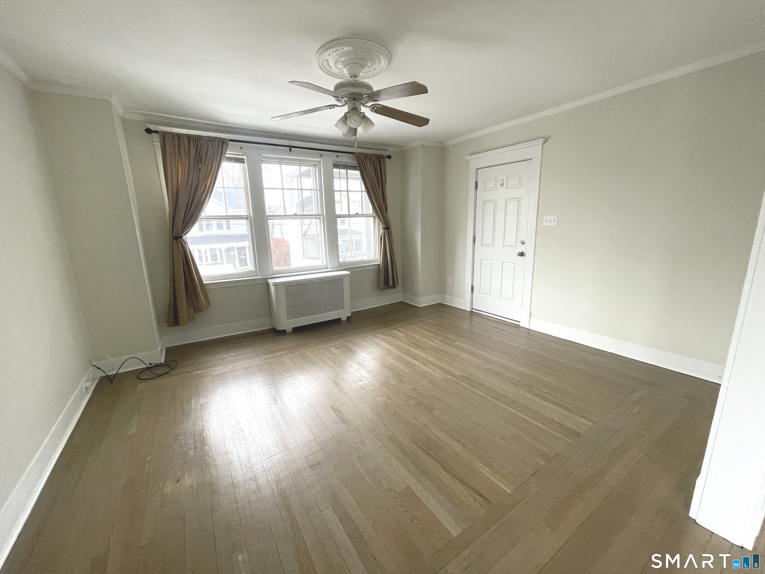 108 Concord Street Hamden, CT 06514 - Photo 1 of 1 an empty room with wooden floor and windows
