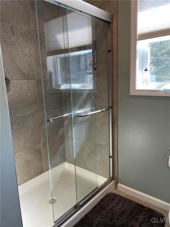 307 Gold Mill Road Wind Gap, PA 18091 - Photo 12 of 32 a bathroom with a glass shower door
