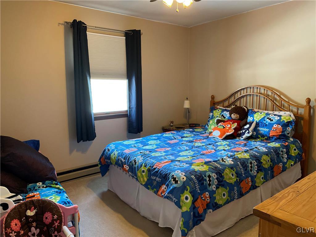 307 Gold Mill Road Wind Gap, PA 18091 - Photo 14 of 32 a bedroom with a bed and a window in it