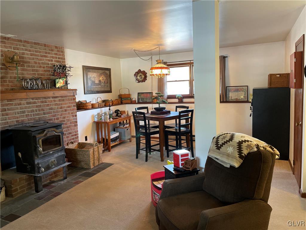 307 Gold Mill Road Wind Gap, PA 18091 - Photo 17 of 32 a living room with furniture and a fireplace