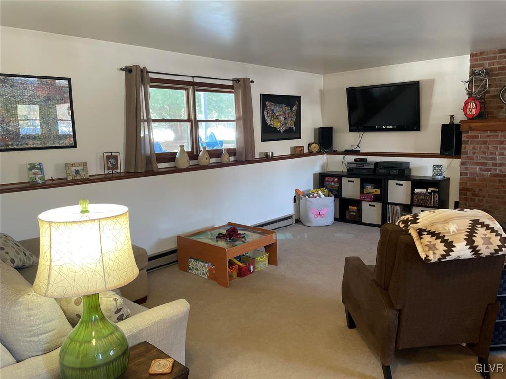 307 Gold Mill Road Wind Gap, PA 18091 - Photo 18 of 32 a living room with furniture and a flat screen tv