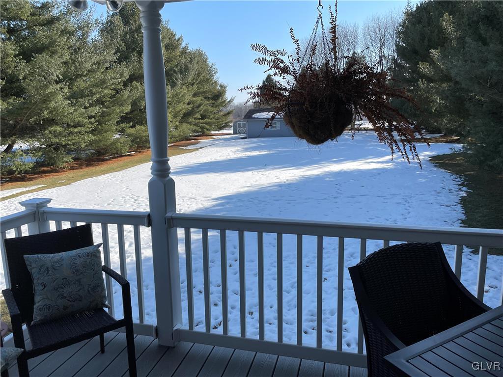 307 Gold Mill Road Wind Gap, PA 18091 - Photo 25 of 32 a view of a balcony with chair and wooden floor