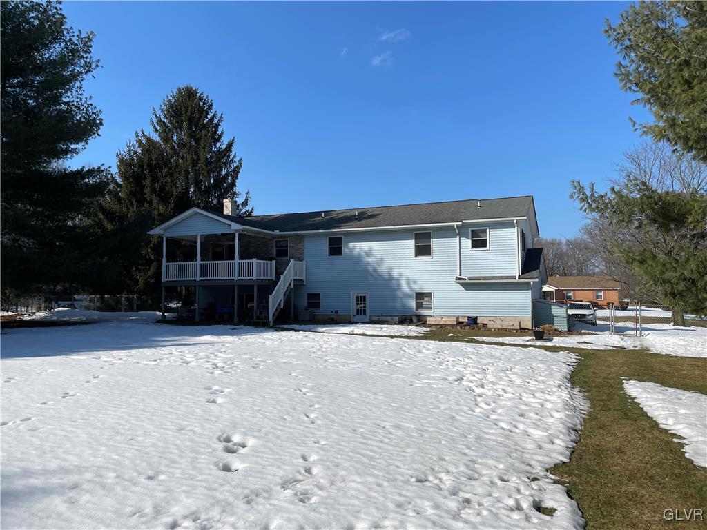 307 Gold Mill Road Wind Gap, PA 18091 - Photo 26 of 32 a front view of a house with a yard and garage
