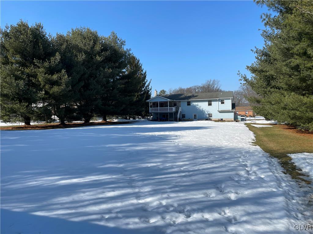 307 Gold Mill Road Wind Gap, PA 18091 - Photo 27 of 32 a view of swimming pool with outdoor seating and trees in the background