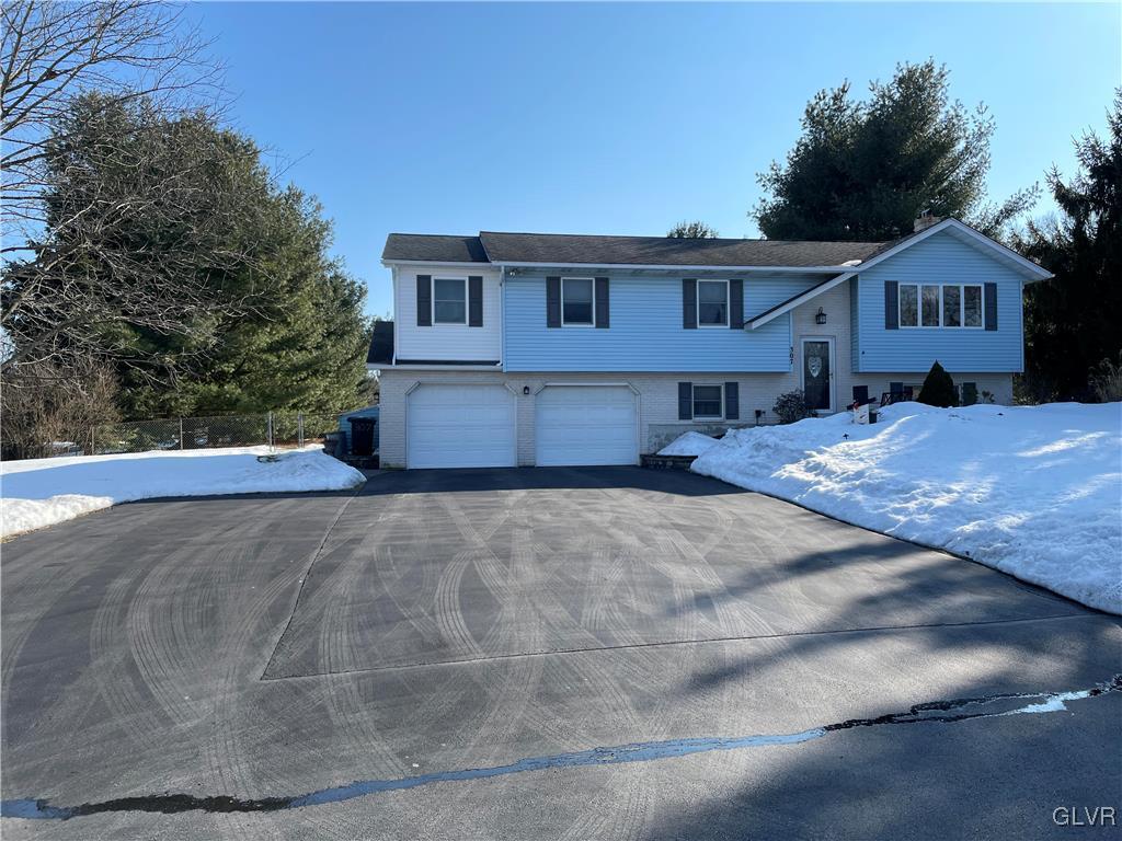 307 Gold Mill Road Wind Gap, PA 18091 - Photo 3 of 32 a front view of a house with a yard