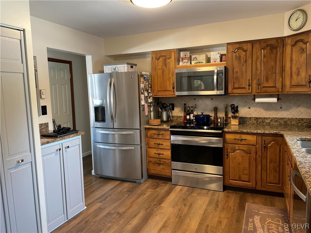 307 Gold Mill Road Wind Gap, PA 18091 - Photo 5 of 32 a kitchen with stainless steel appliances a refrigerator stove and sink