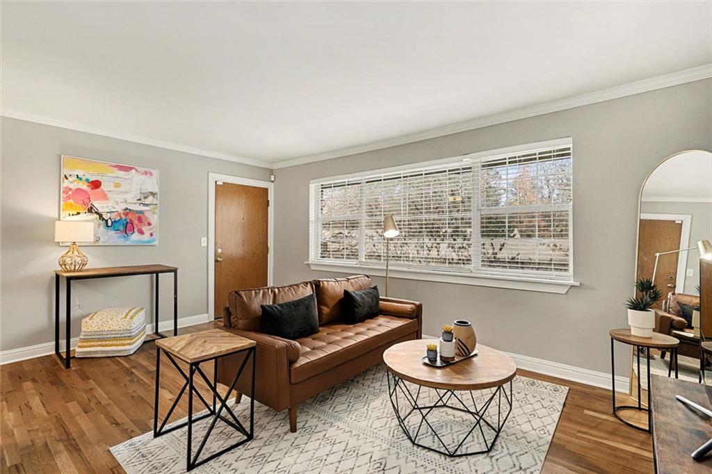 a living room with furniture and a window