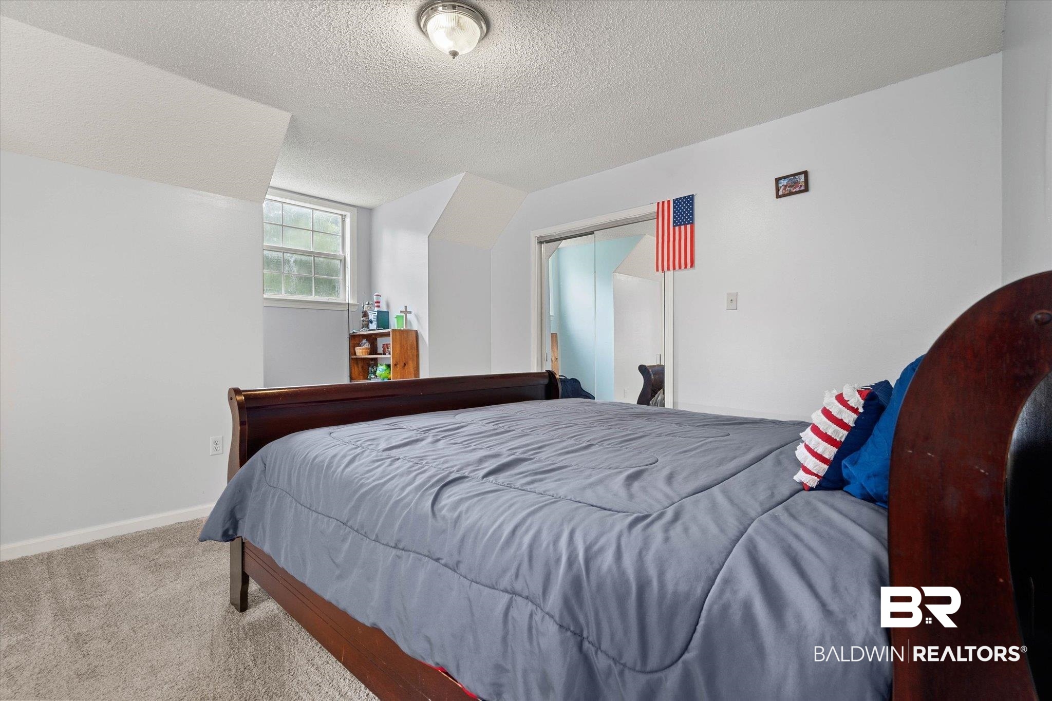 2300 Radcliff Road Saraland, AL 36571 - Photo 30 of 56 Carpeted bedroom featuring a textured ceiling and a closet