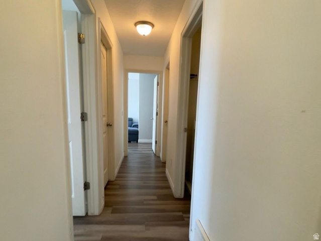 90 East Resaca Drive, Unit C11 Sandy, UT 84070 - Photo 9 of 27 Hall featuring wood finished floors and baseboards