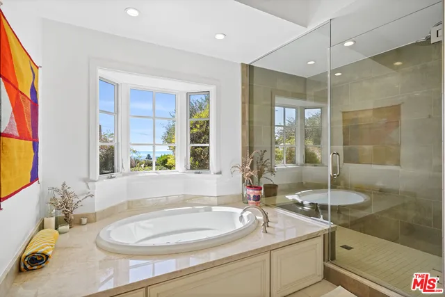 a bath room with a sink and a mirror