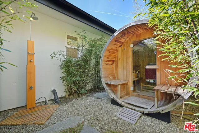 a view of a patio with couches and potted plants