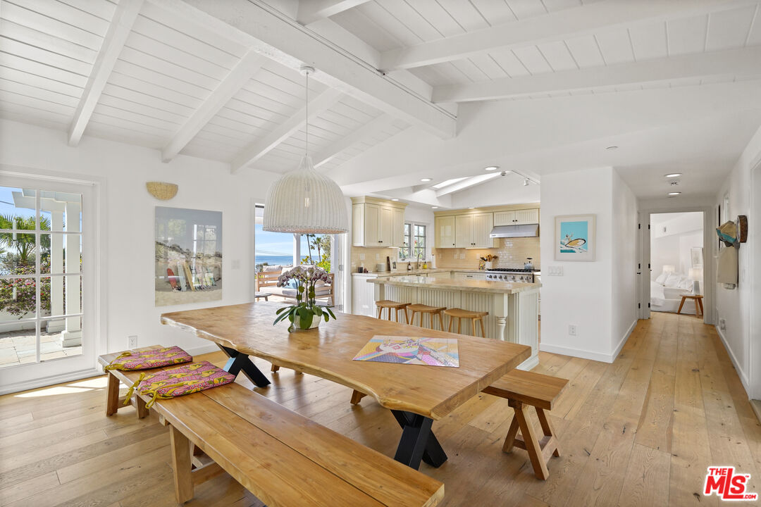 30081 Harvester Road Malibu, CA 90265 - Photo 5 of 33 a view of a dining room with furniture and wooden floor