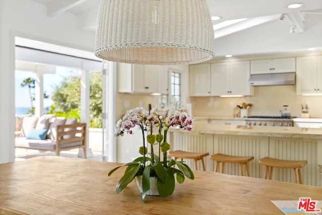a kitchen with a table and chairs in it