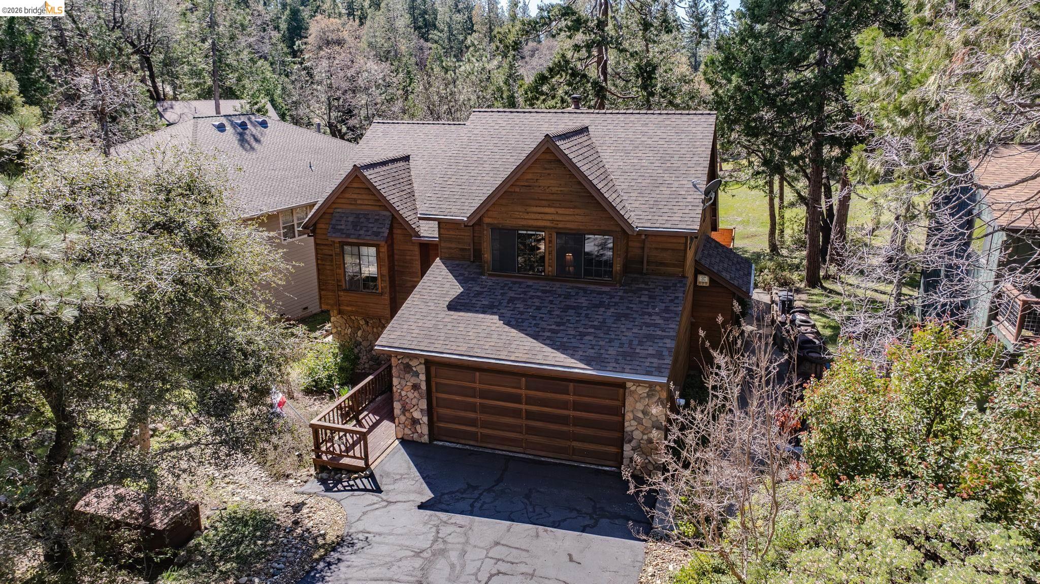 1554 Vine Maple Drive Murphys, CA 95247 - Photo 1 of 54 an aerial view of a house with a yard