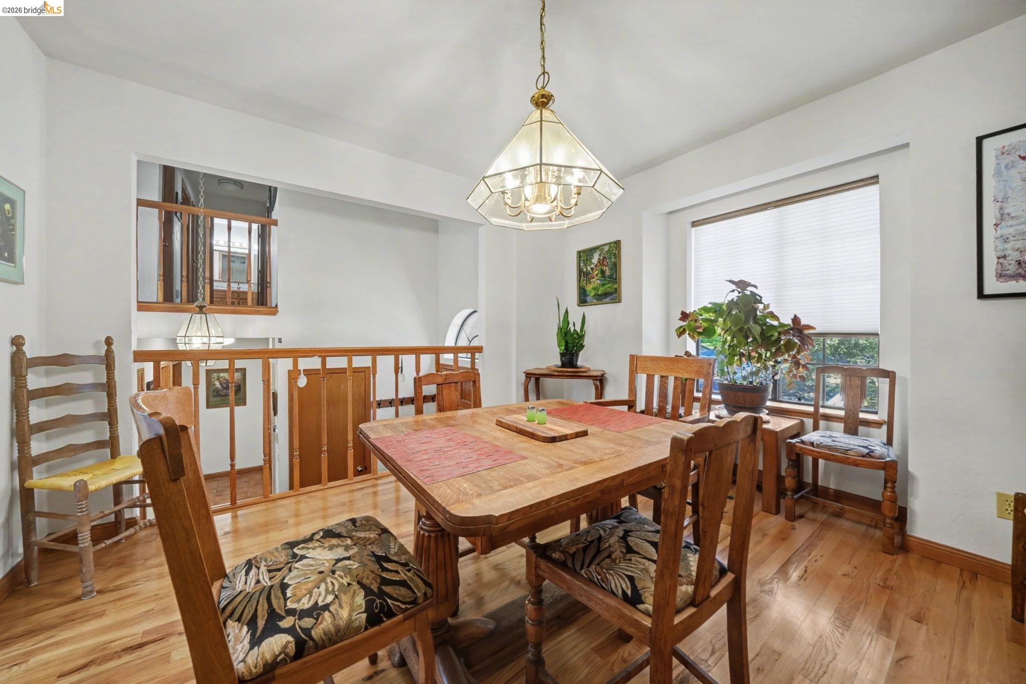 1554 Vine Maple Drive Murphys, CA 95247 - Photo 22 of 54 a view of a dining room with furniture window and wooden floor