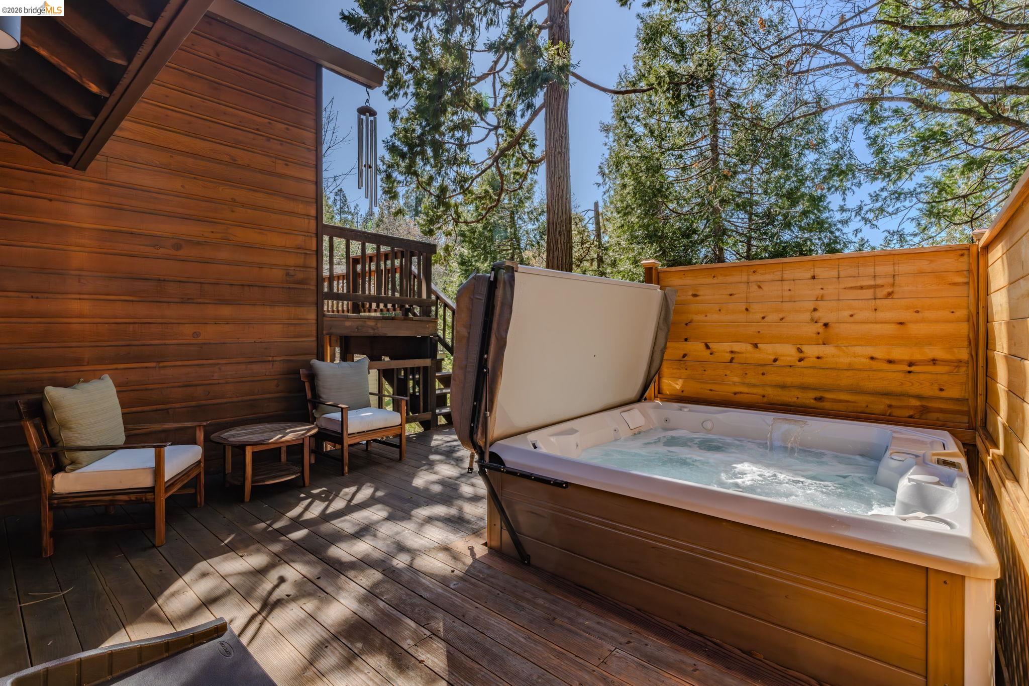 1554 Vine Maple Drive Murphys, CA 95247 - Photo 31 of 54 a wooden bench sitting in backside of a house