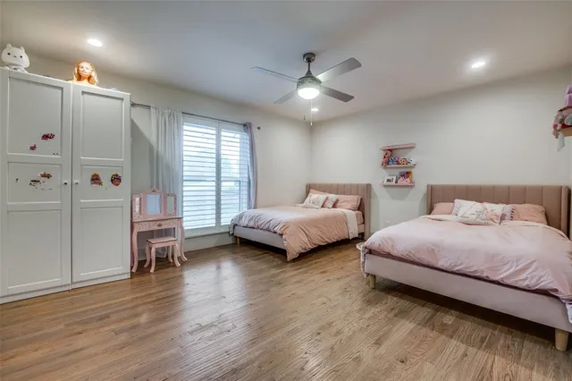 a bedroom with a large bed and a couch