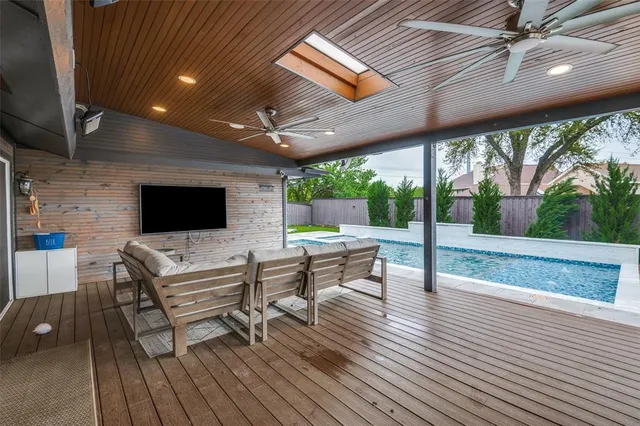 a dinning table and chairs in patio of a house