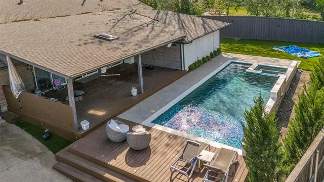 an aerial view of a house with outdoor space