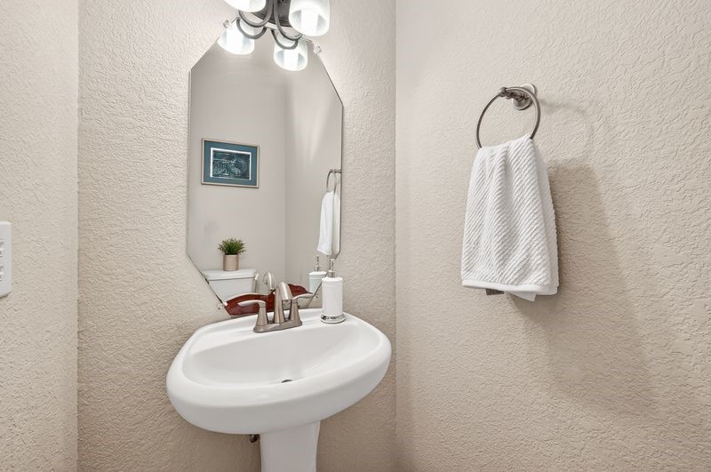 111 South Rocky Point Circle Spring, TX 77389 - Photo 19 of 41 a bathroom with a sink a mirror and vanity