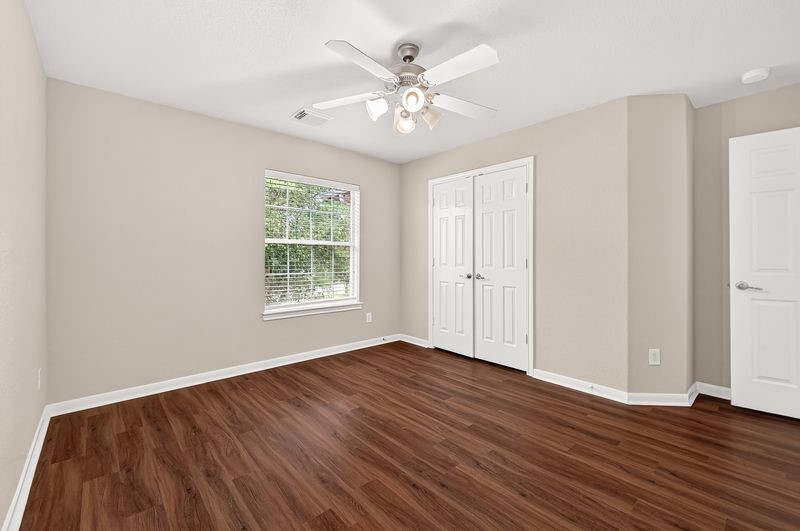 111 South Rocky Point Circle Spring, TX 77389 - Photo 27 of 41 a view of an empty room with wooden floor and a window
