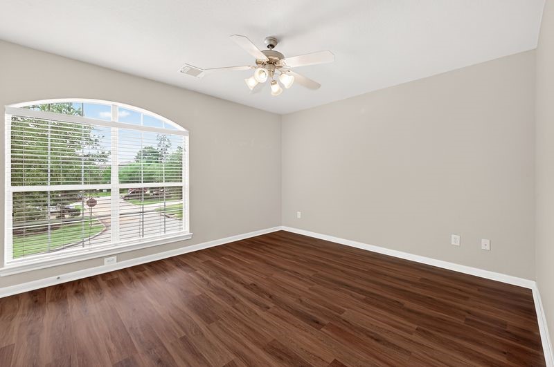 111 South Rocky Point Circle Spring, TX 77389 - Photo 30 of 41 wooden floor in an empty room with a window