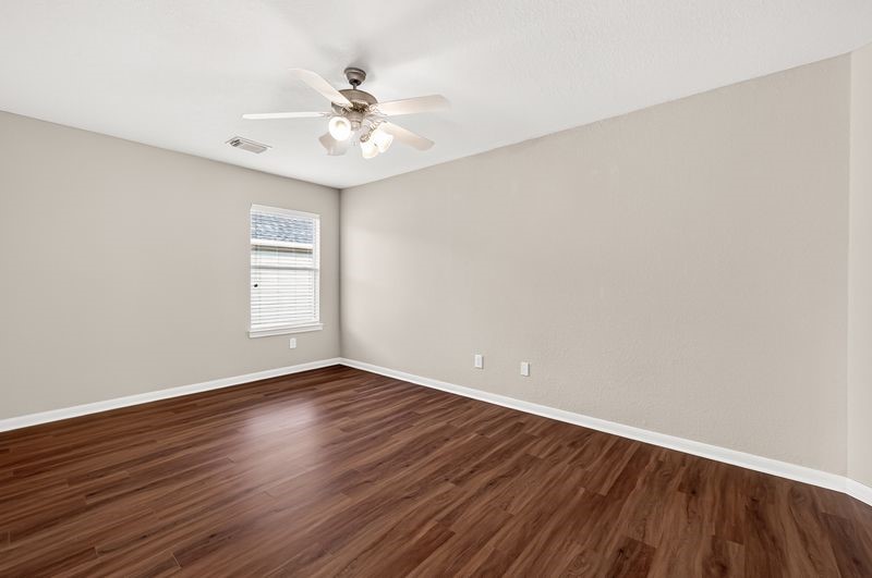 111 South Rocky Point Circle Spring, TX 77389 - Photo 32 of 41 a view of an empty room with wooden floor and a window