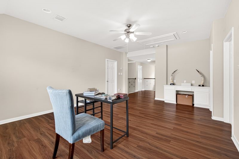 111 South Rocky Point Circle Spring, TX 77389 - Photo 35 of 41 a view of a dining room with furniture and wooden floor