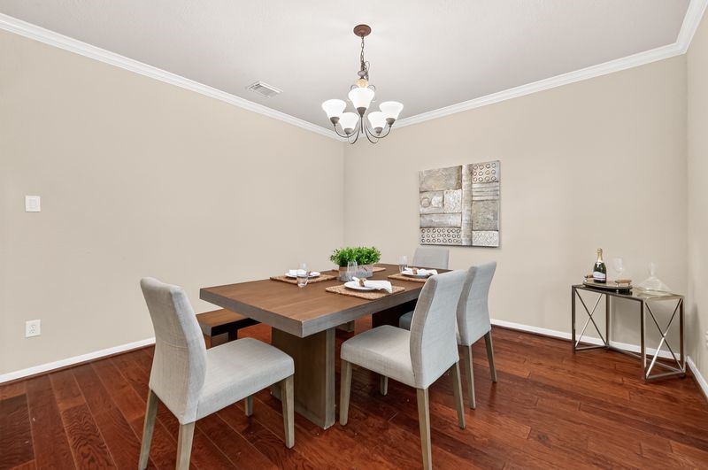 111 South Rocky Point Circle Spring, TX 77389 - Photo 5 of 41 a view of a dining room with furniture wooden floor and chandelier