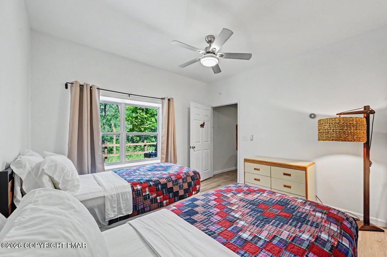 2016 Locust Ridge Road Pocono Lake, PA 18347 - Photo 63 of 82 a bedroom with a bed and a window