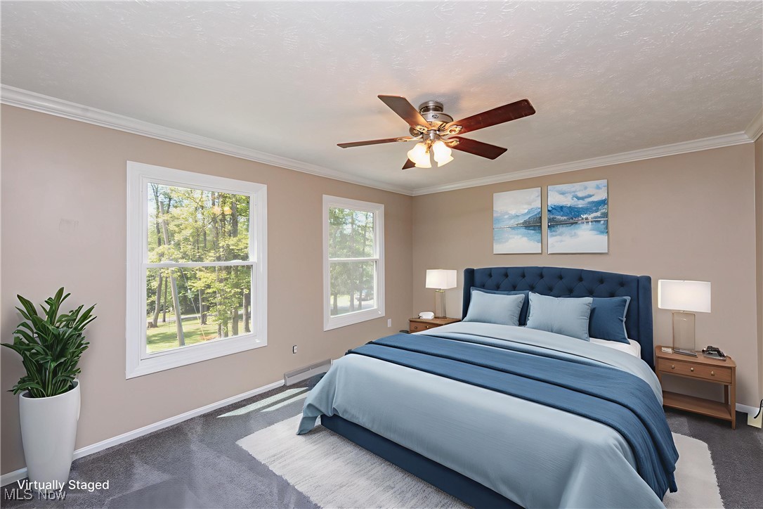 13655 Sperry Road Novelty, OH 44072 - Photo 15 of 32 Carpeted bedroom featuring crown molding, ceiling fan, a textured ceiling, and a baseboard radiator