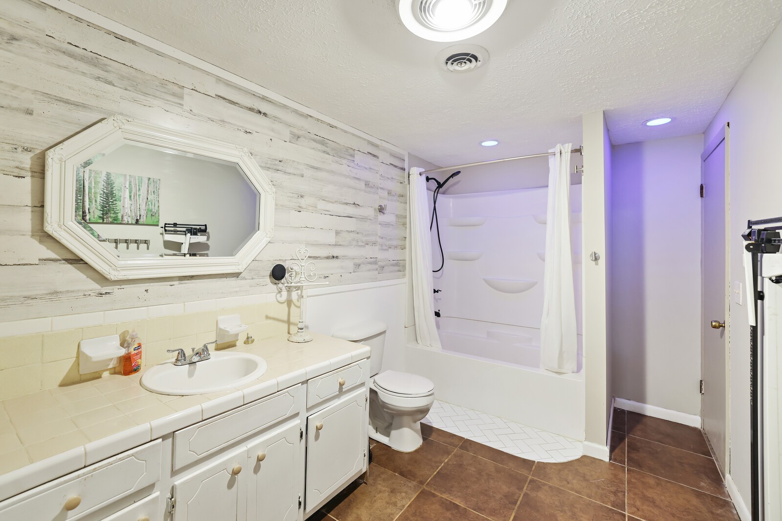 676 Ferguson Hill Road Lafayette, TN 37083 - Photo 58 of 89 a bathroom with a sink a toilet and shower