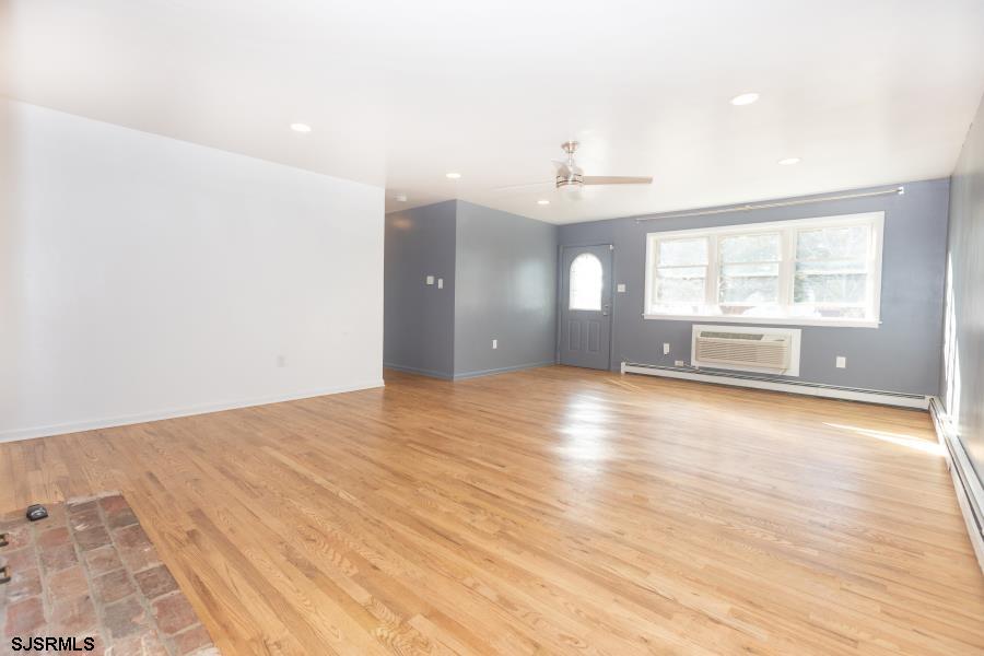 30 South Old Tuckahoe Road Marmora, NJ 08223 - Photo 16 of 35 an empty room with wooden floor and windows