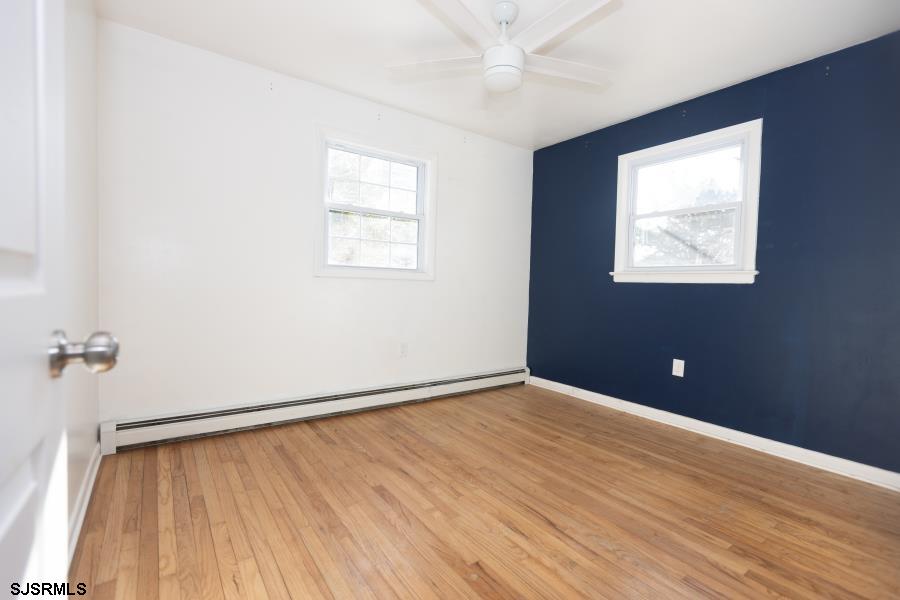 30 South Old Tuckahoe Road Marmora, NJ 08223 - Photo 28 of 35 wooden floor in an empty room with a window