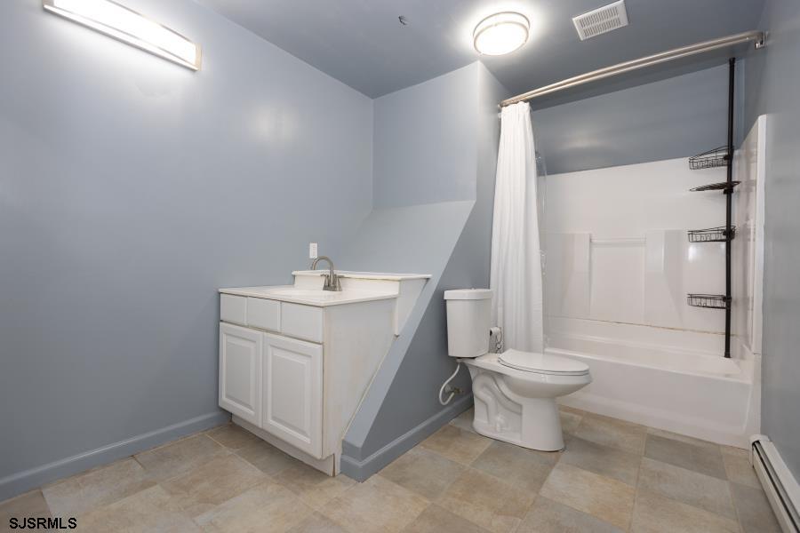 30 South Old Tuckahoe Road Marmora, NJ 08223 - Photo 31 of 35 a bathroom with a toilet sink and a mirror