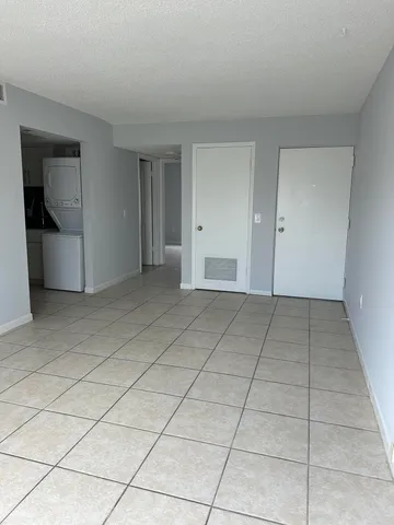 a view of a livingroom with an empty space and a sink
