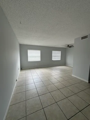 a view of an empty room and window