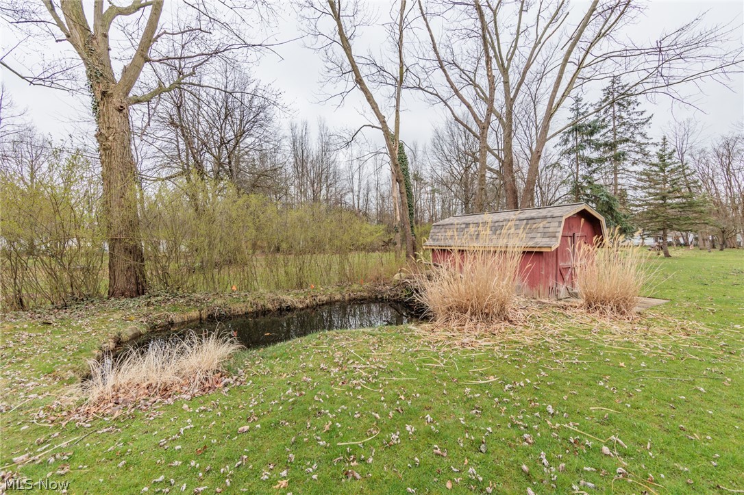 490 Trebisky Road Cleveland, OH 44143 - Photo 44 of 49 View of yard featuring an outdoor structure and a water view