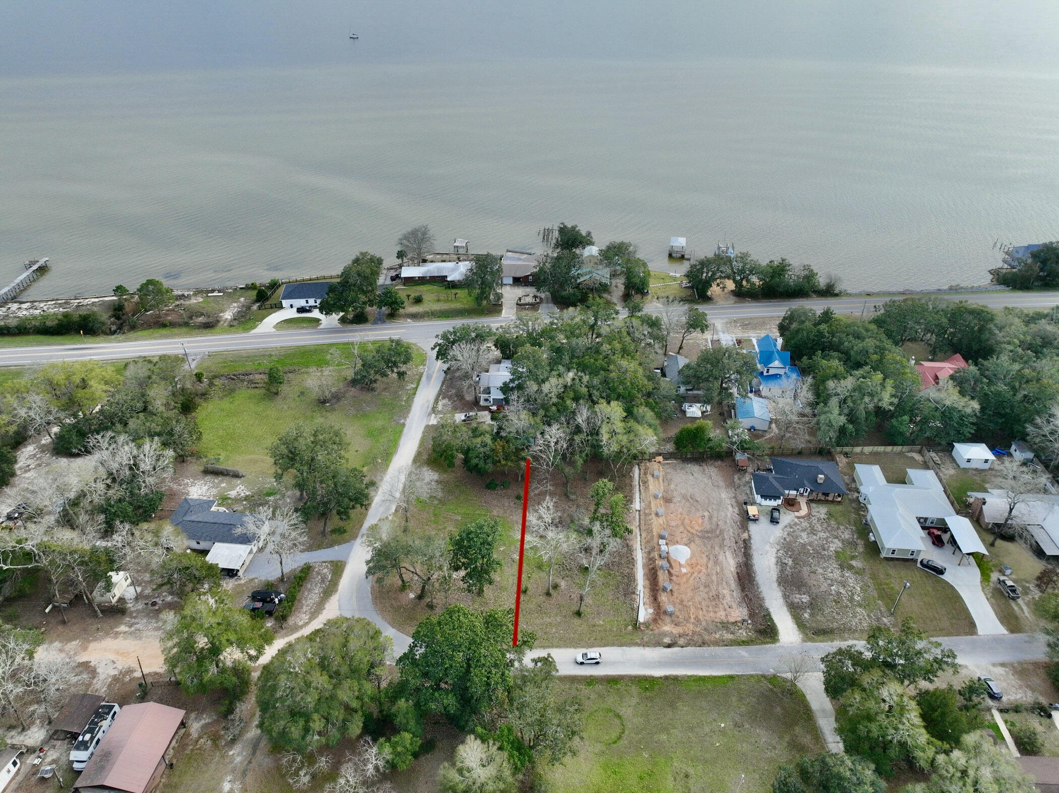 Lot 20 Satsuma Road Niceville, FL 32578 - Photo 7 of 35 an aerial view of a house with a yard and lake view