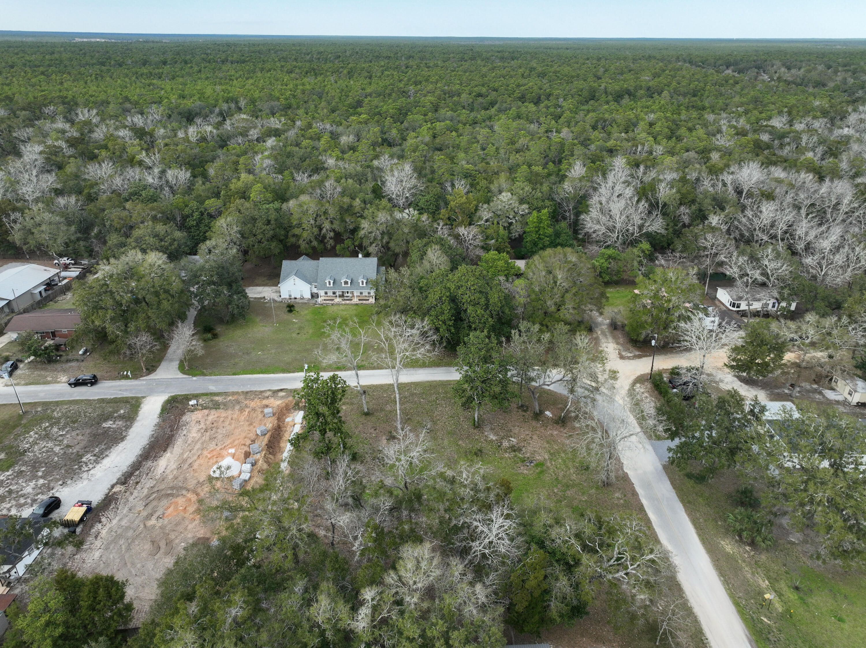 Lot 20 Satsuma Road Niceville, FL 32578 - Photo 8 of 35 an aerial view of residential houses with outdoor space and trees